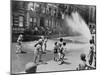 Children Escape the Heat of the East Side by Opening a Fire Hydrant, New York City, June 1943-null-Mounted Photo