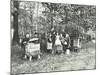 Children Feeding Bees for the Winter, Shrewsbury House Open Air School, London, 1909-null-Mounted Premium Photographic Print