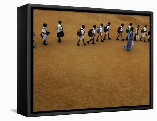 Children Follow Their Teacher as They Head Back to School for the First Time after the Tsunami-null-Framed Stretched Canvas