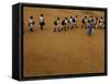 Children Follow Their Teacher as They Head Back to School for the First Time after the Tsunami-null-Framed Stretched Canvas