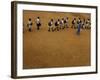 Children Follow Their Teacher as They Head Back to School for the First Time after the Tsunami-null-Framed Photographic Print