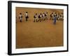 Children Follow Their Teacher as They Head Back to School for the First Time after the Tsunami-null-Framed Photographic Print