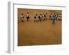 Children Follow Their Teacher as They Head Back to School for the First Time after the Tsunami-null-Framed Photographic Print