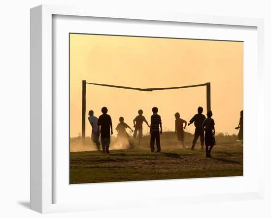 Children from the Toba Qom Ethnic Group Play Soccer During Indegenous Indian Day Celebration-null-Framed Premium Photographic Print