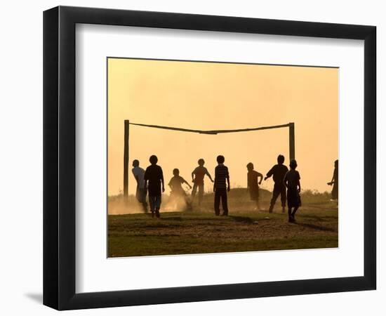 Children from the Toba Qom Ethnic Group Play Soccer During Indegenous Indian Day Celebration-null-Framed Photographic Print