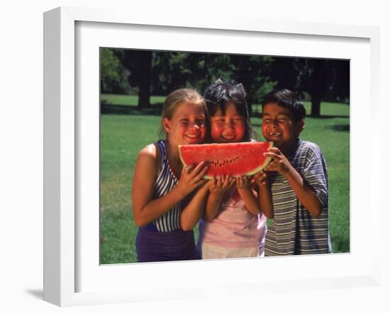 Children in Park Eating Watermelon-Mark Gibson-Framed Premium Photographic Print