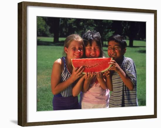 Children in Park Eating Watermelon-Mark Gibson-Framed Photographic Print