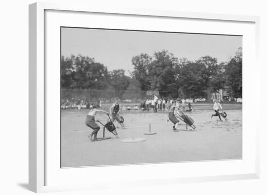 Children In Wheel Barrow Race-null-Framed Art Print