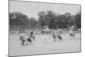 Children In Wheel Barrow Race-null-Mounted Art Print