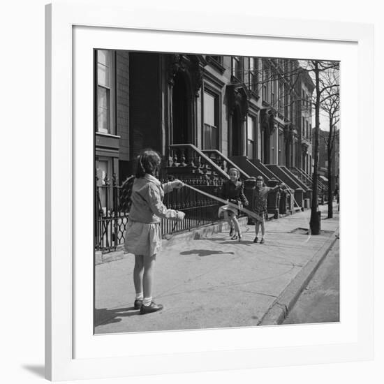 Children Jump Roping on Sidewalk Next to Brooklyn Brownstones, NY, 1949-Ralph Morse-Framed Photographic Print