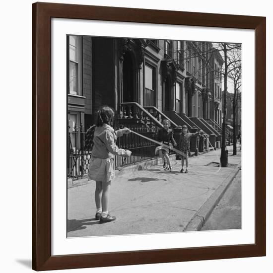 Children Jump Roping on Sidewalk Next to Brooklyn Brownstones, NY, 1949-Ralph Morse-Framed Photographic Print