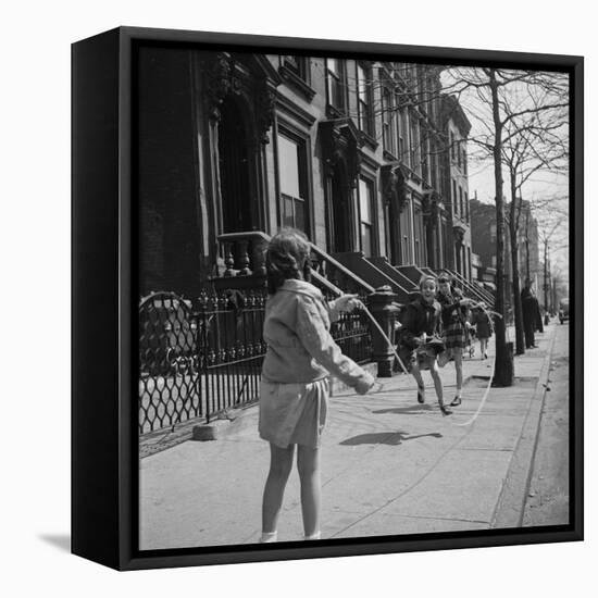 Children Jump Roping on Sidewalk Next to Brooklyn Brownstones, NY, 1949-Ralph Morse-Framed Stretched Canvas