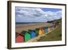 Children Kick Football Near Colourful Beach Huts Above West Cliff Beach-Eleanor Scriven-Framed Photographic Print