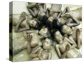 Children Lie in Sludge as a Ritual to Induce Rain in Nari Bari, India-null-Stretched Canvas