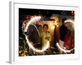 Children Light Firecrackers for the Hindu Festival of Diwali in New Delhi, India, Oct. 20, 2006-Manish Swarup-Framed Photographic Print