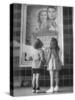 Children Looking at Posters Outside Movie Theater-Charles E^ Steinheimer-Stretched Canvas