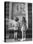 Children Looking at Posters Outside Movie Theater-Charles E^ Steinheimer-Stretched Canvas