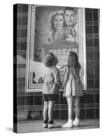 Children Looking at Posters Outside Movie Theater-Charles E^ Steinheimer-Stretched Canvas