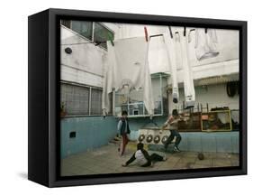 Children of an Immigrant Family from Bolivia Play Soccer at Their House-null-Framed Stretched Canvas