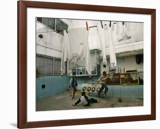 Children of an Immigrant Family from Bolivia Play Soccer at Their House-null-Framed Photographic Print