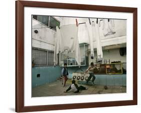 Children of an Immigrant Family from Bolivia Play Soccer at Their House-null-Framed Photographic Print