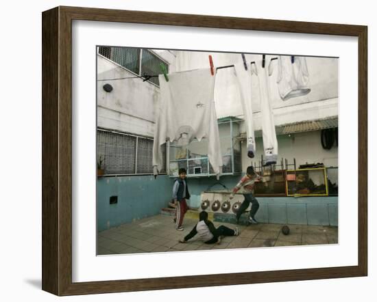 Children of an Immigrant Family from Bolivia Play Soccer at Their House-null-Framed Photographic Print
