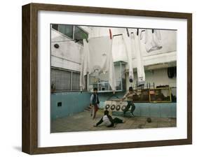 Children of an Immigrant Family from Bolivia Play Soccer at Their House-null-Framed Photographic Print