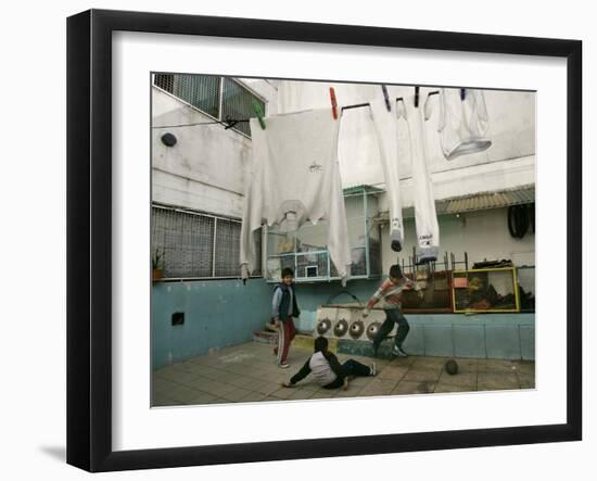 Children of an Immigrant Family from Bolivia Play Soccer at Their House-null-Framed Photographic Print