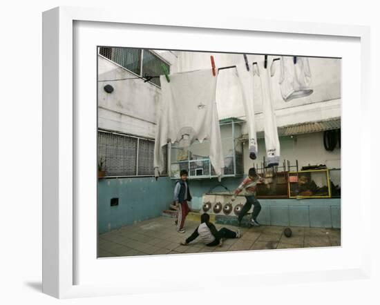 Children of an Immigrant Family from Bolivia Play Soccer at Their House-null-Framed Photographic Print