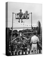 Children on Rides at an Amusement Park at a Beach Resort-null-Stretched Canvas