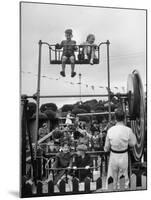 Children on Rides at an Amusement Park at a Beach Resort-null-Mounted Photographic Print