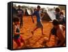 Children Play Soccer Between Tents Placed on a Dusty Lot-null-Framed Stretched Canvas