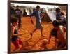 Children Play Soccer Between Tents Placed on a Dusty Lot-null-Framed Photographic Print