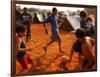 Children Play Soccer Between Tents Placed on a Dusty Lot-null-Framed Photographic Print