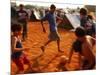 Children Play Soccer Between Tents Placed on a Dusty Lot-null-Mounted Photographic Print