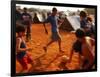 Children Play Soccer Between Tents Placed on a Dusty Lot-null-Framed Photographic Print