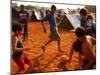 Children Play Soccer Between Tents Placed on a Dusty Lot-null-Mounted Photographic Print