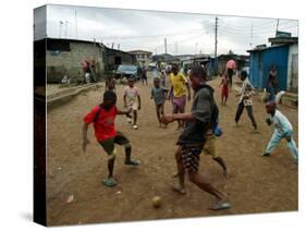 Children Play Soccer in an Impoverished Street in Lagos, Nigeria-null-Stretched Canvas