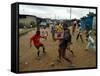 Children Play Soccer in an Impoverished Street in Lagos, Nigeria-null-Framed Stretched Canvas