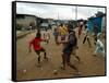 Children Play Soccer in an Impoverished Street in Lagos, Nigeria-null-Framed Stretched Canvas