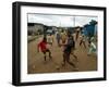 Children Play Soccer in an Impoverished Street in Lagos, Nigeria-null-Framed Premium Photographic Print