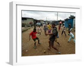 Children Play Soccer in an Impoverished Street in Lagos, Nigeria-null-Framed Premium Photographic Print