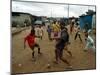 Children Play Soccer in an Impoverished Street in Lagos, Nigeria-null-Mounted Premium Photographic Print