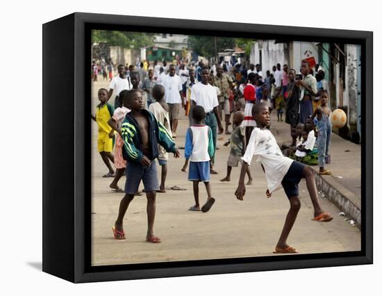 Children Play Soccer on a Monrovian Street-null-Framed Stretched Canvas