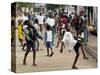 Children Play Soccer on a Monrovian Street-null-Stretched Canvas