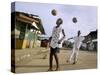 Children Play Soccer on a Street-null-Stretched Canvas
