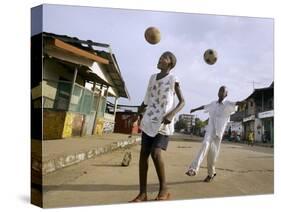 Children Play Soccer on a Street-null-Stretched Canvas