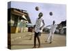 Children Play Soccer on a Street-null-Stretched Canvas