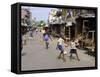 Children Play Soccer on One of the Streets of the Business District of Lagos-null-Framed Stretched Canvas