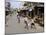 Children Play Soccer on One of the Streets of the Business District of Lagos-null-Mounted Premium Photographic Print